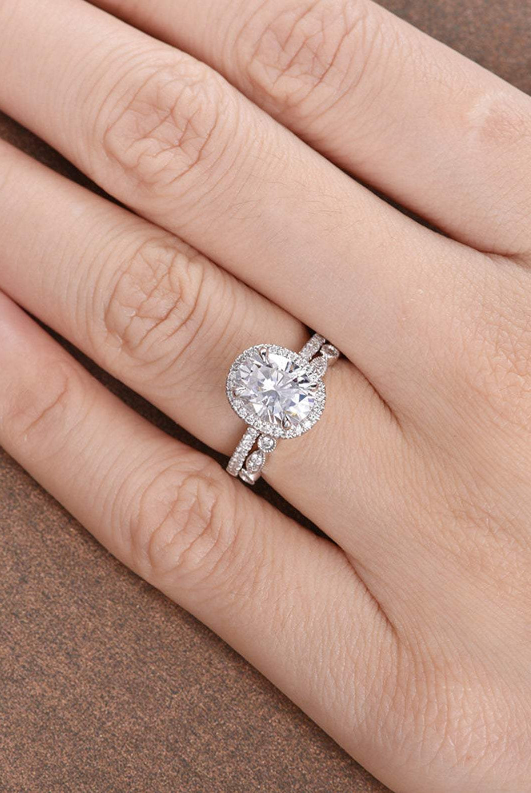 oval-cut-halo-moissanite-bridal-ring-set