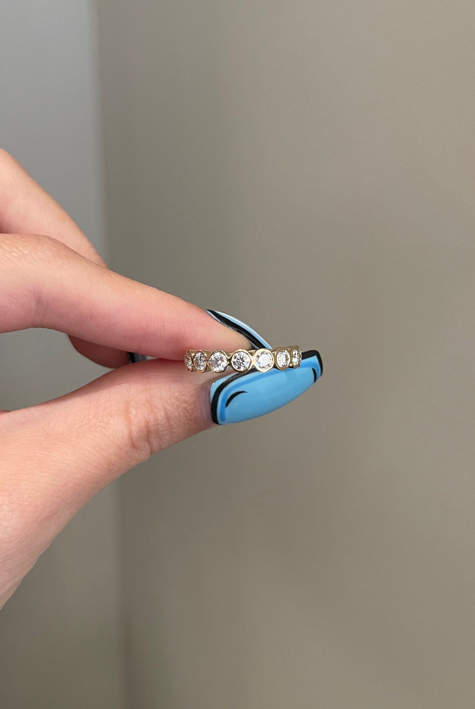 round-shaped-moissanite-bezel-half-eternity-wedding-band