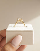 sparkling pave moissanite ring, round solitaire with pave band, brilliant cut moissanite ring, round pave setting ring, moissanite diamond alternative, elegant round moissanite engagement ring, handcrafted pave setting ring, modern round cut ring, round moissanite for her