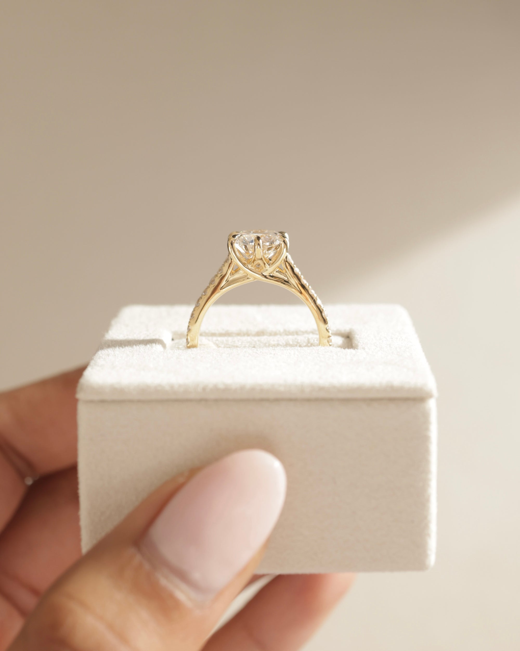 sparkling pave moissanite ring, round solitaire with pave band, brilliant cut moissanite ring, round pave setting ring, moissanite diamond alternative, elegant round moissanite engagement ring, handcrafted pave setting ring, modern round cut ring, round moissanite for her