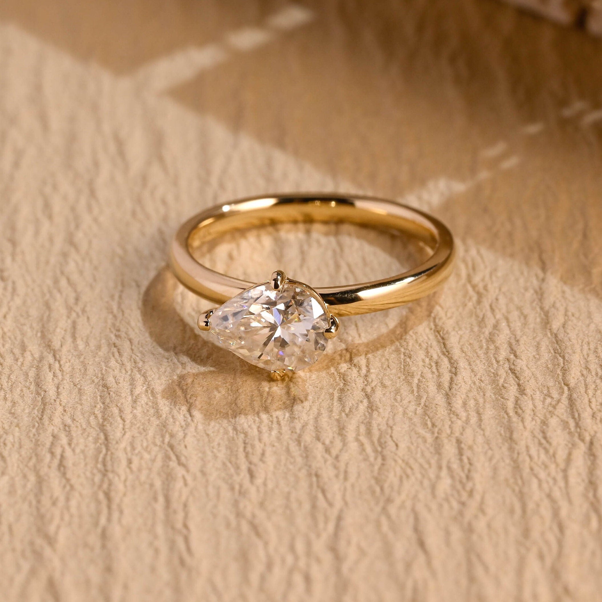 1 carat east west pear moissanite engagement ring