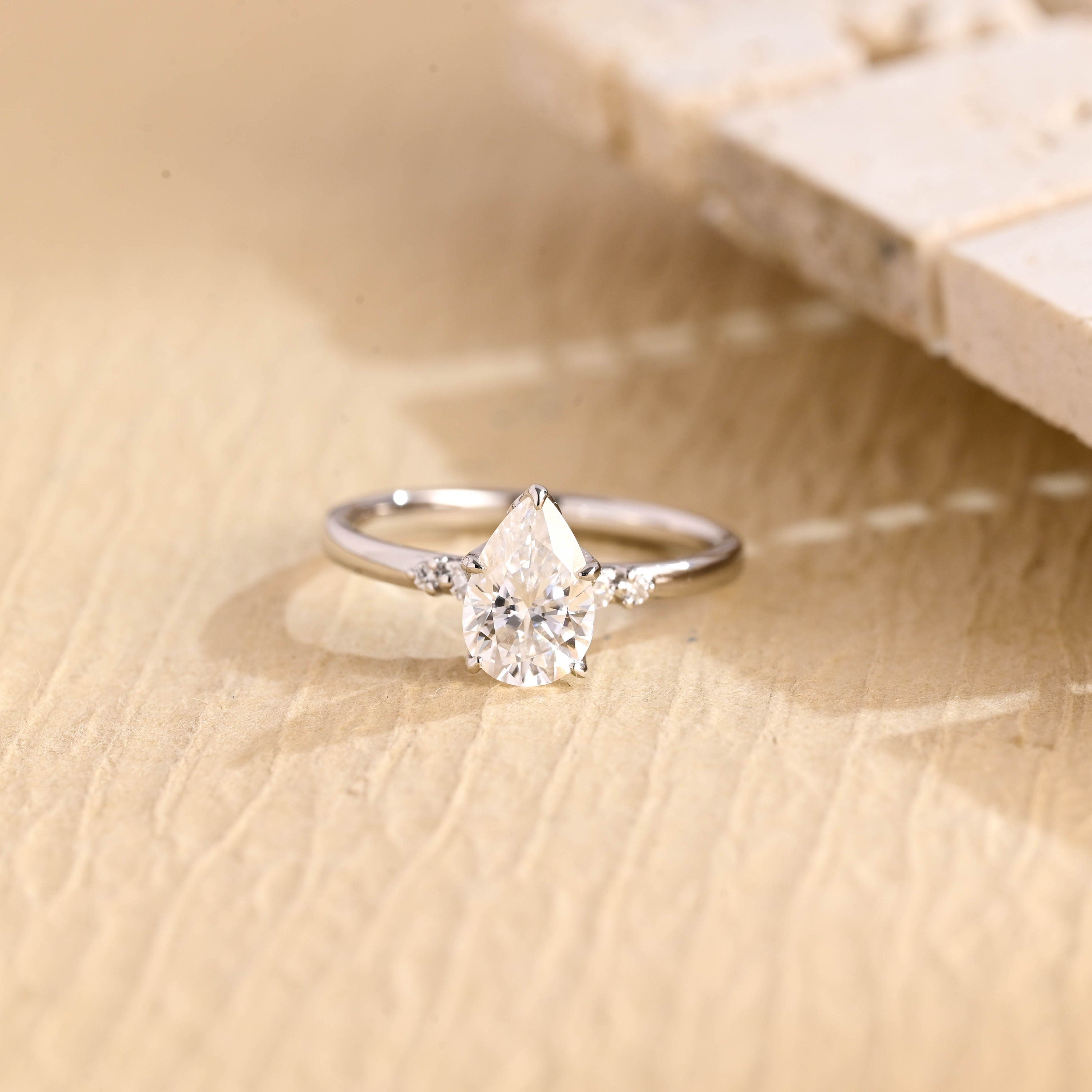 1 carat pear five stone engagement ring moissanite