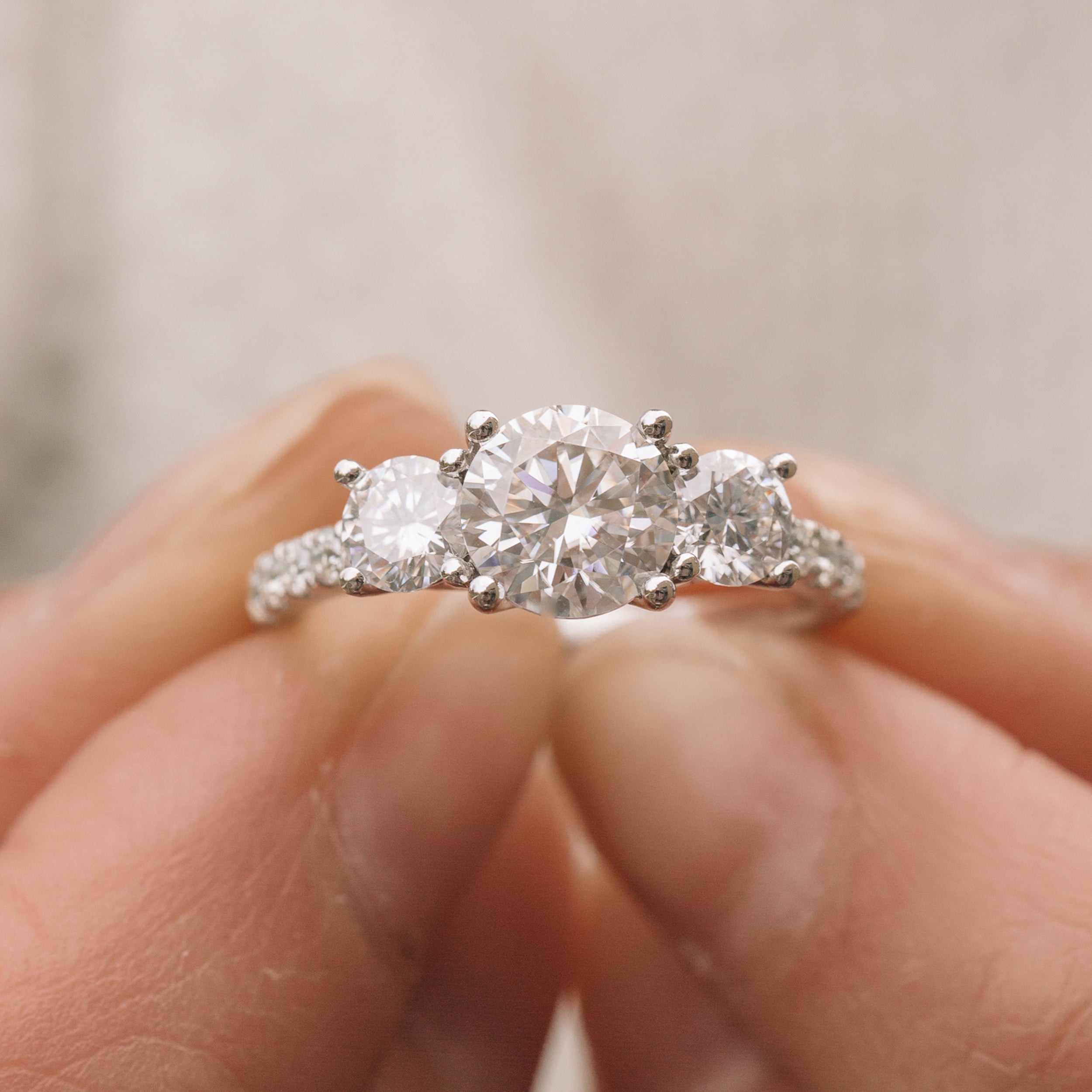 Round Three Stone Moissanite Ring