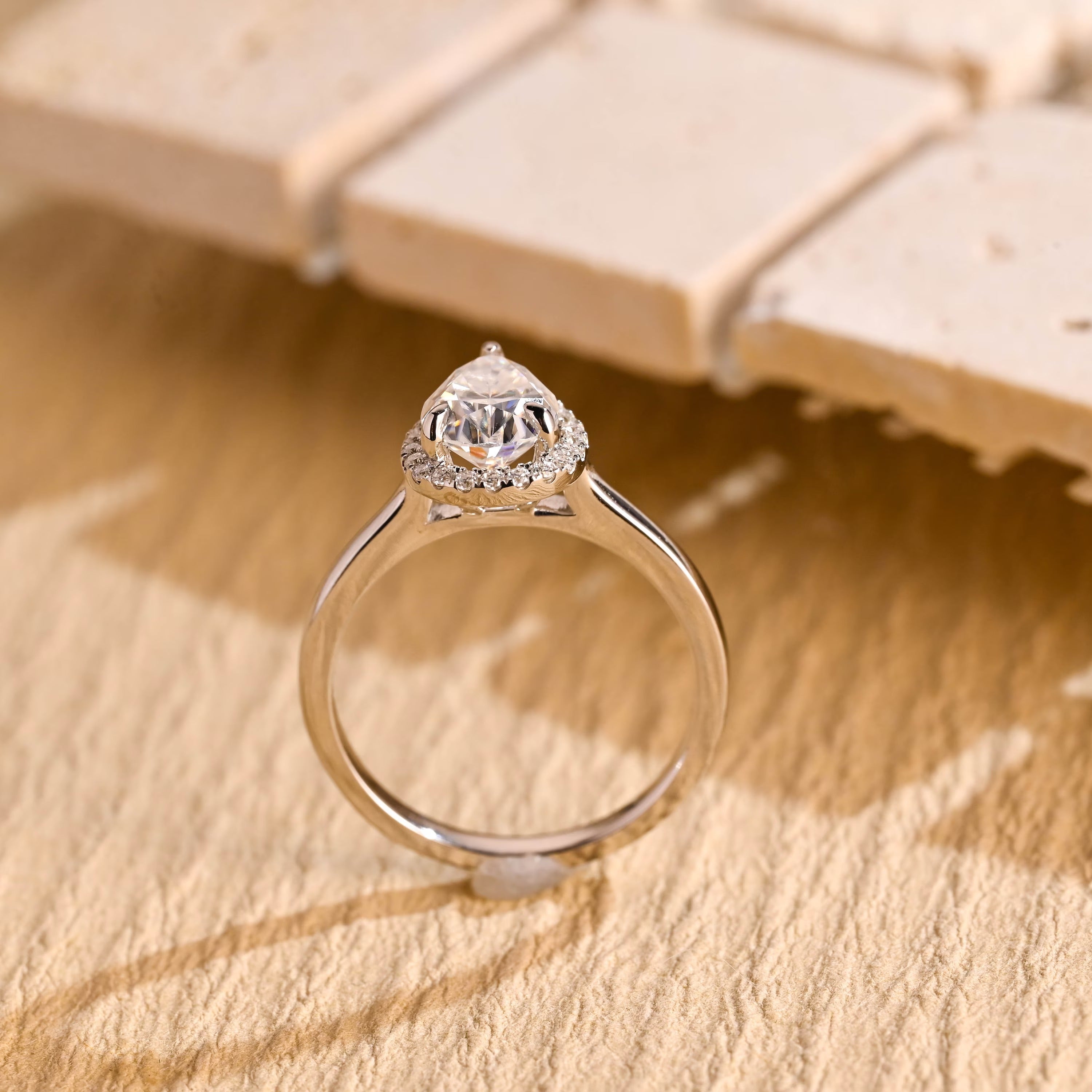 sustainable pear halo engagement ring moissanite
