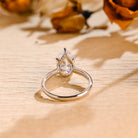 affordable luxury pear hidden halo moissanite ring