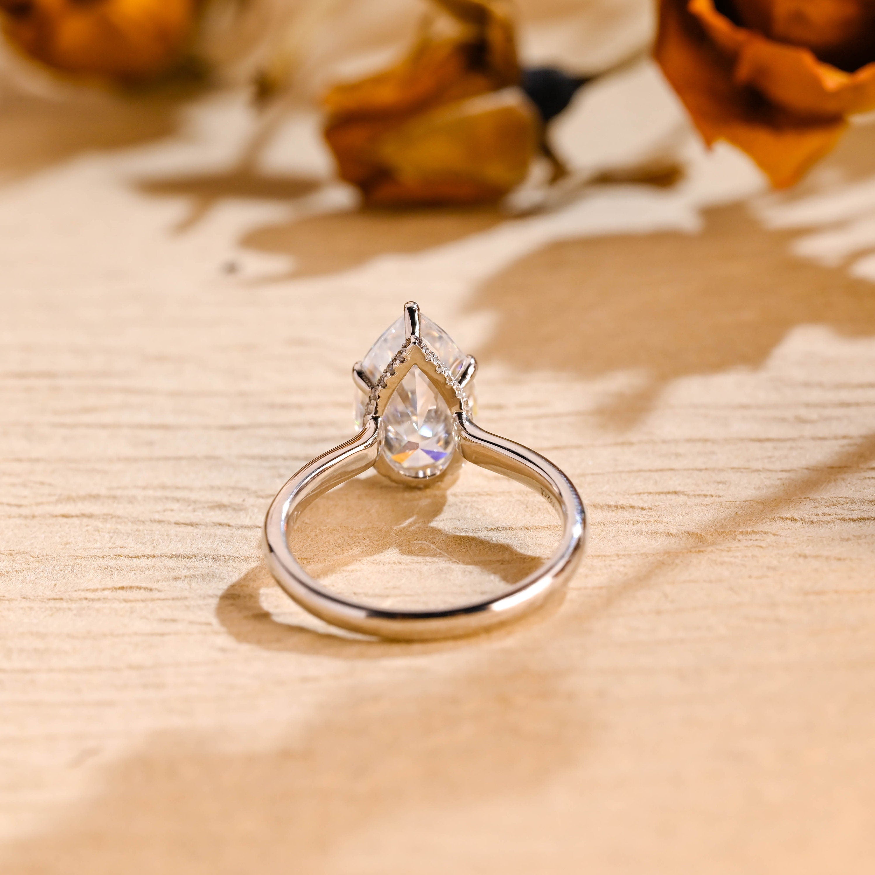 affordable luxury pear hidden halo moissanite ring