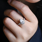 sparkling pear cut three stone moissanite ring