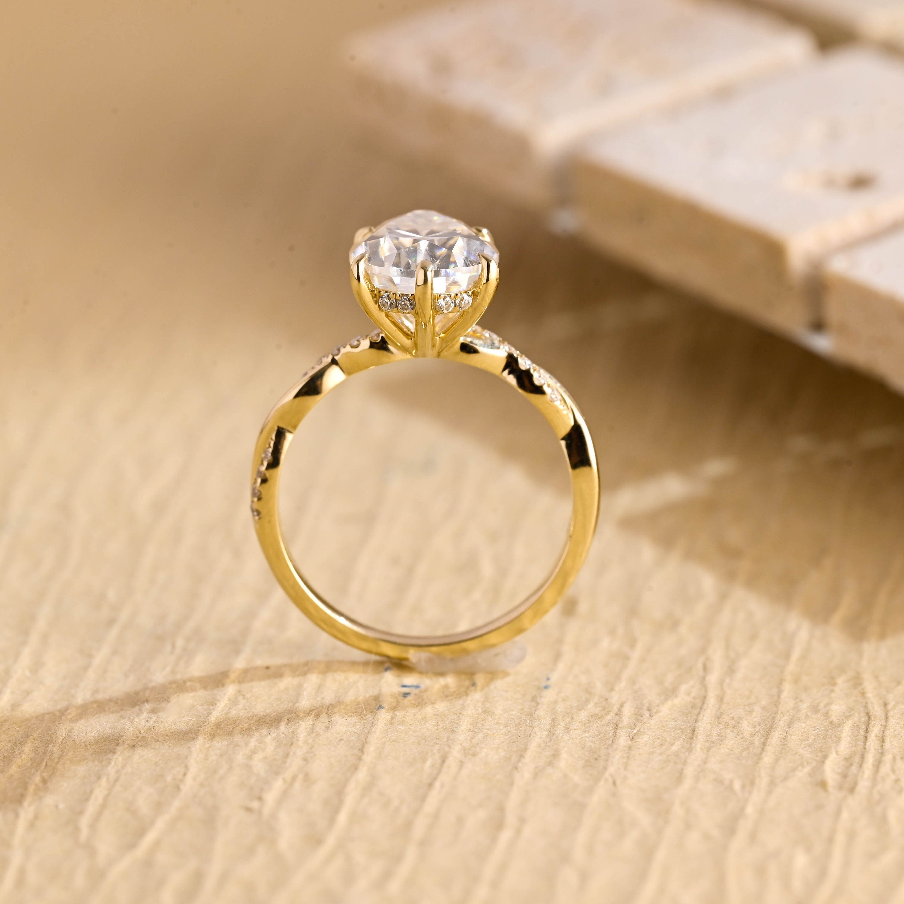 engagement ring pear twisted hidden halo moissanite