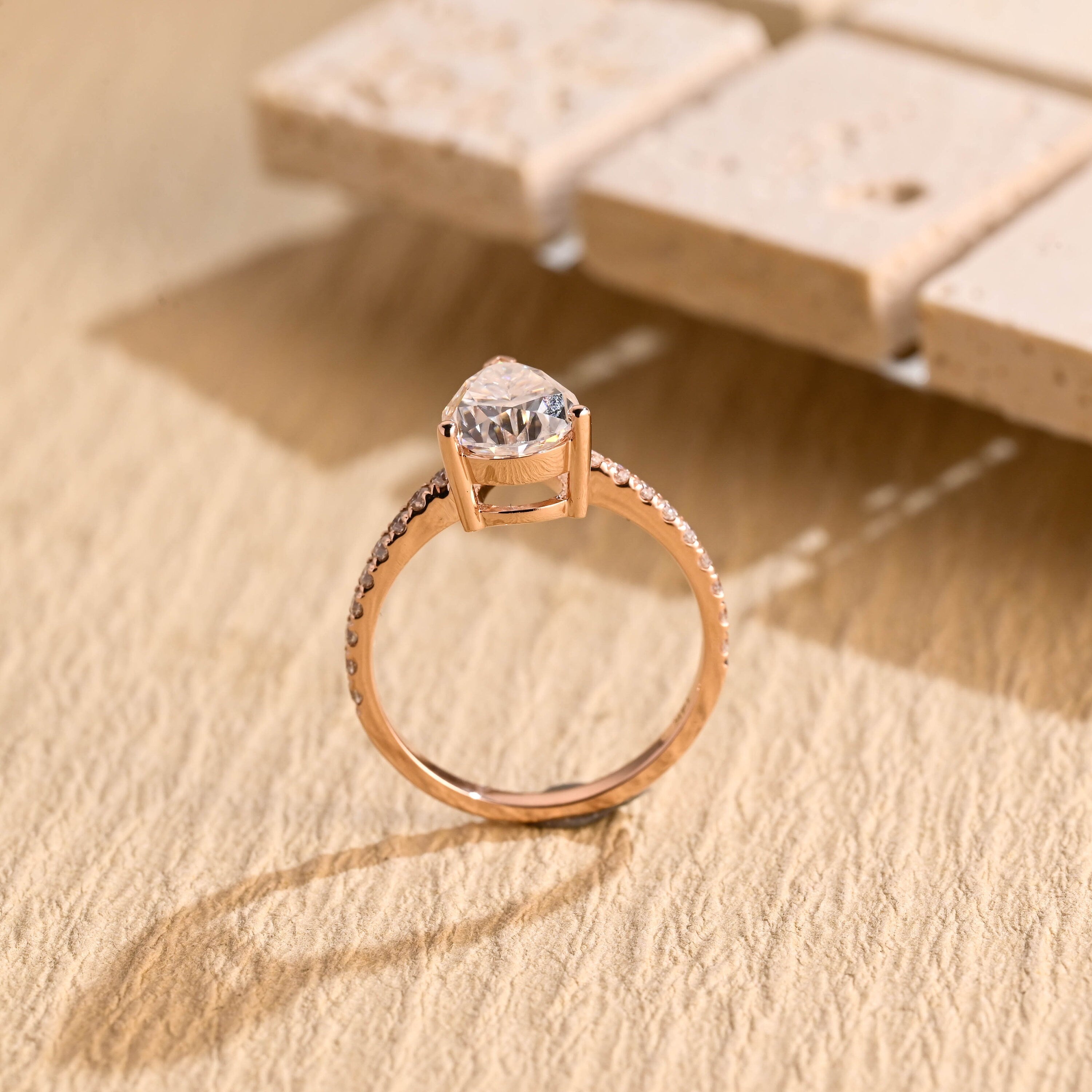 halo alternative pear pavé moissanite ring