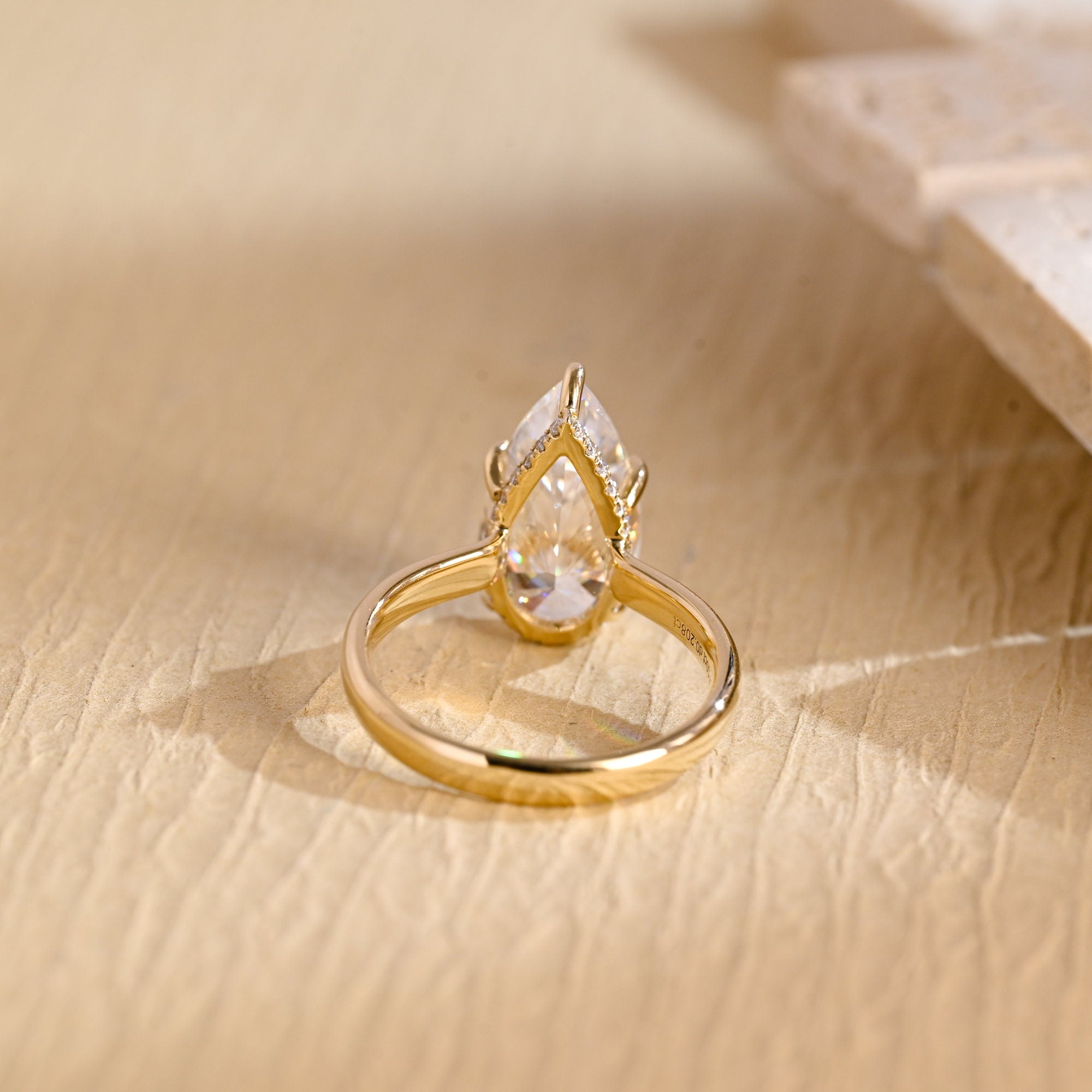 diamond hidden halo pear moissanite engagement ring