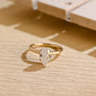 pear cut hidden halo moissanite engagement ring