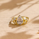 pear cut seven stone bezel moissanite engagement ring