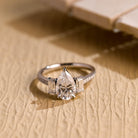 pear cut three stone pavé moissanite engagement ring