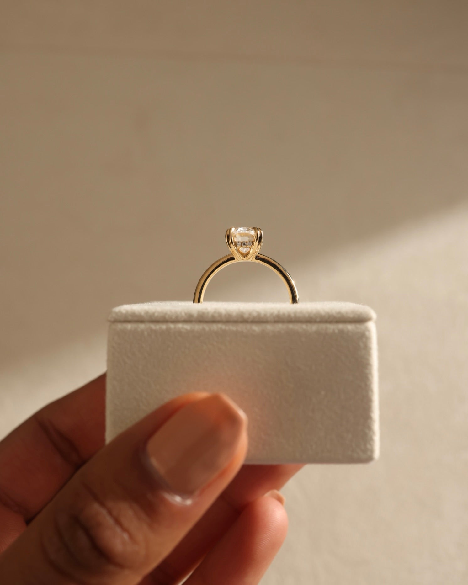 classic hidden halo engagement ring, handcrafted moissanite ring, modern oval cut ring, timeless oval solitaire, oval hidden halo bridal ring, luxury moissanite engagement ring, romantic oval cut ring, oval shaped moissanite ring