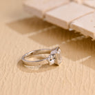 minimalist emerald bezel cluster moissanite engagement ring