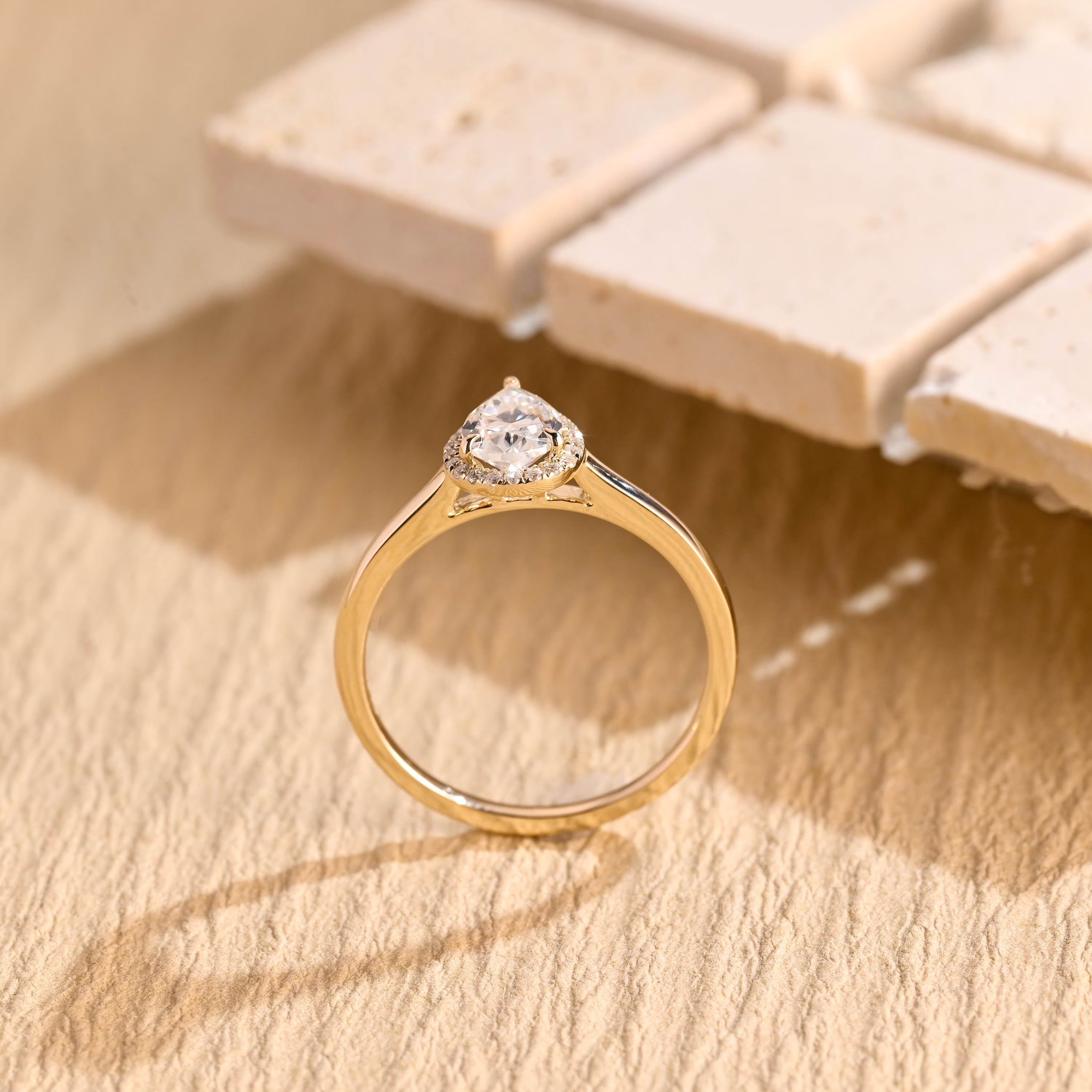 sparkling pear cut halo engagement ring moissanite