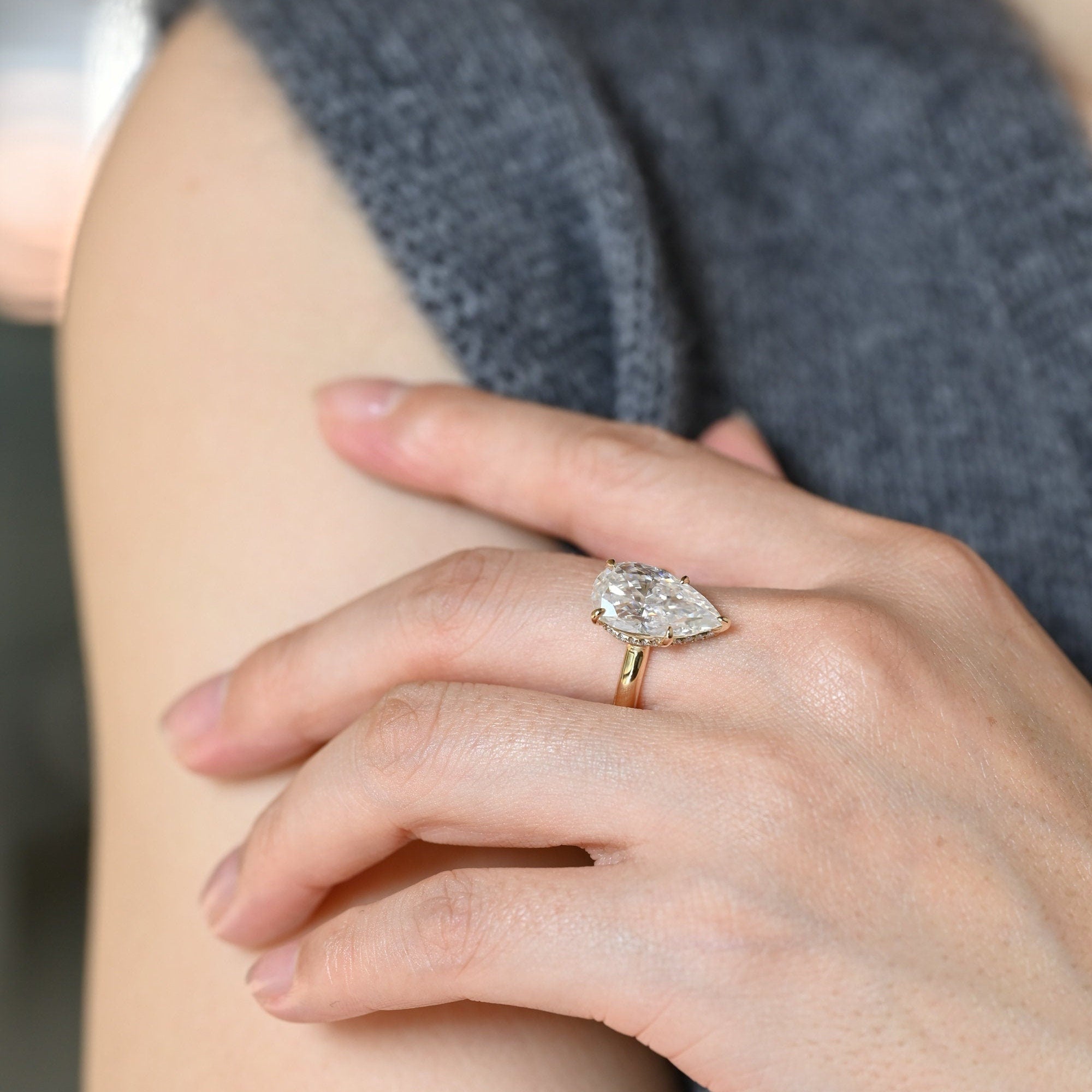 sparkling pear hidden halo engagement ring moissanite