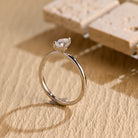 sustainable pear solitaire engagement ring moissanite