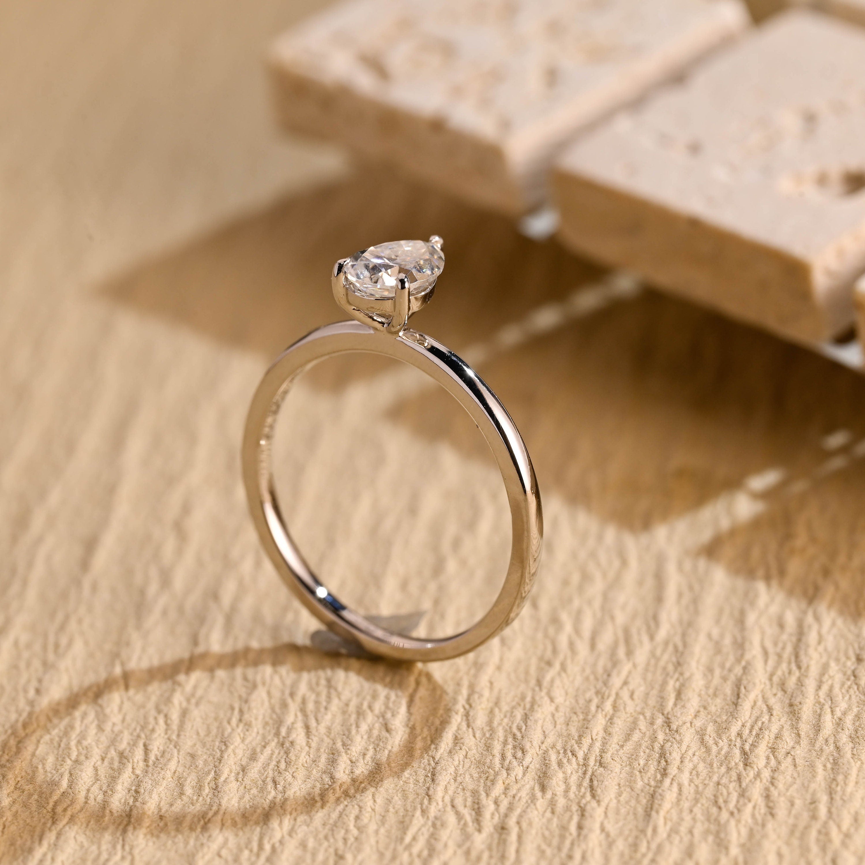 sustainable pear solitaire engagement ring moissanite