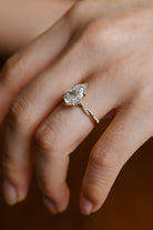 pear cut moissanite twisted halo ring