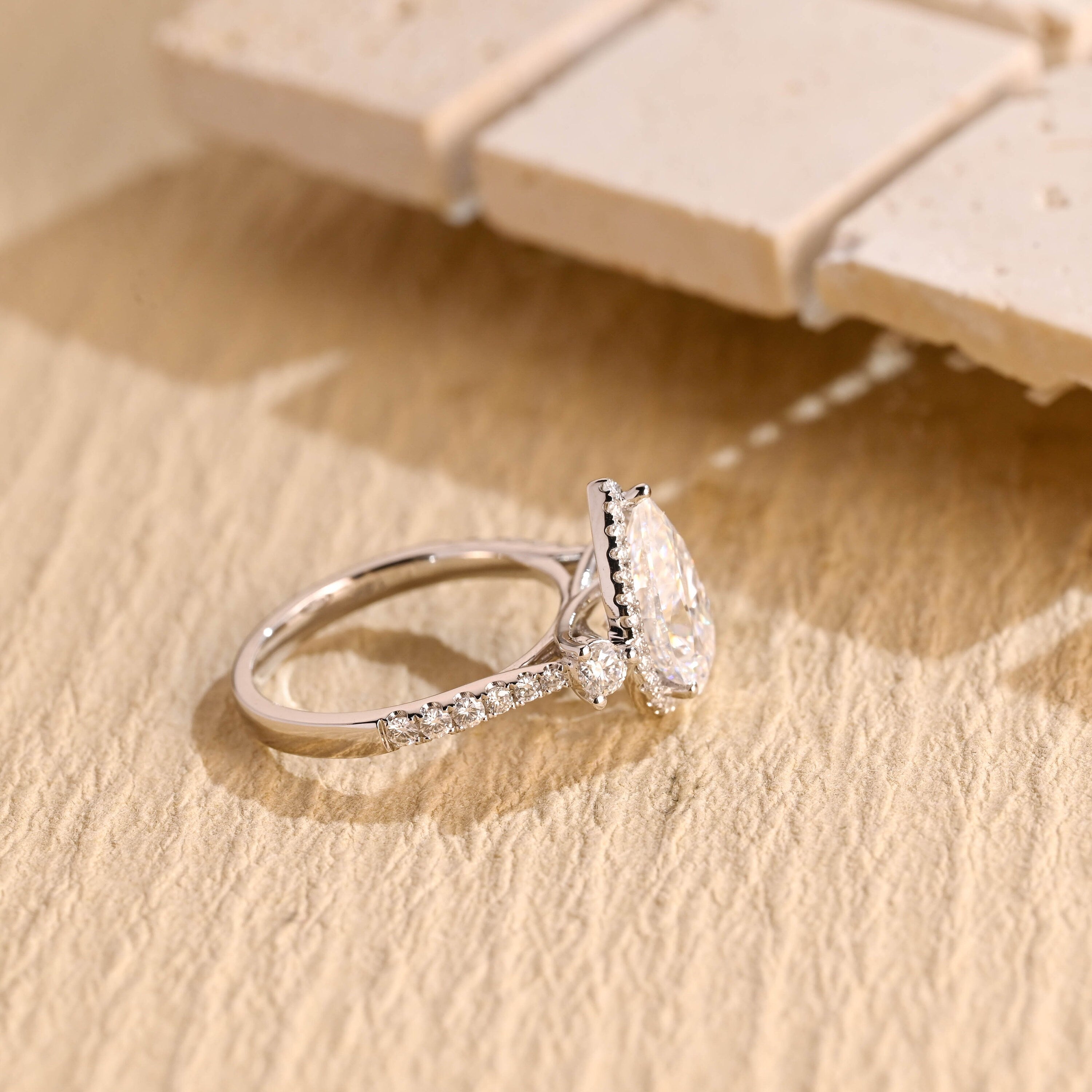 designer pear three stone engagement ring moissanite