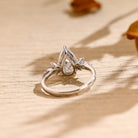 sustainable pear cluster engagement ring moissanite