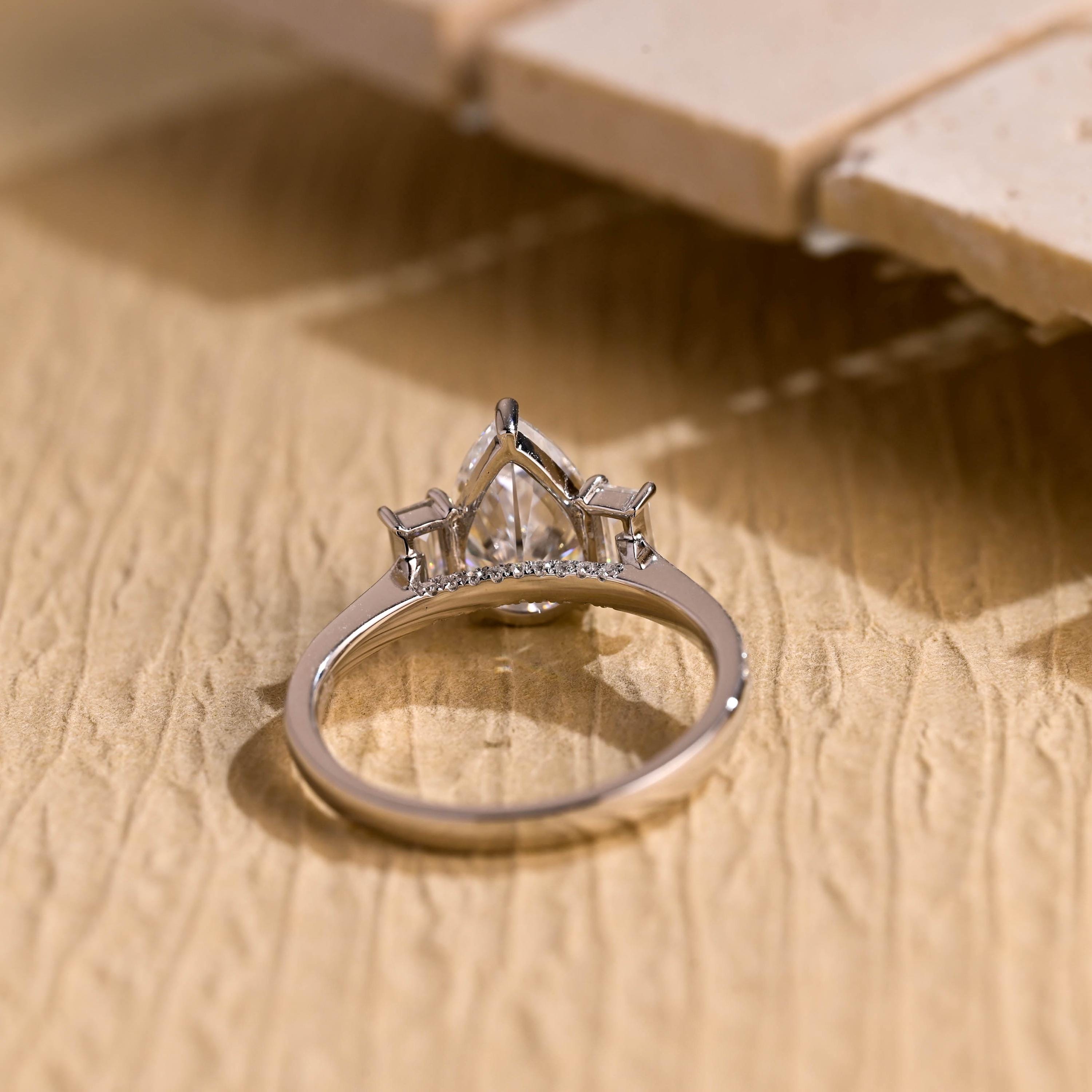 1ct pear moissanite three stone engagement ring pavé