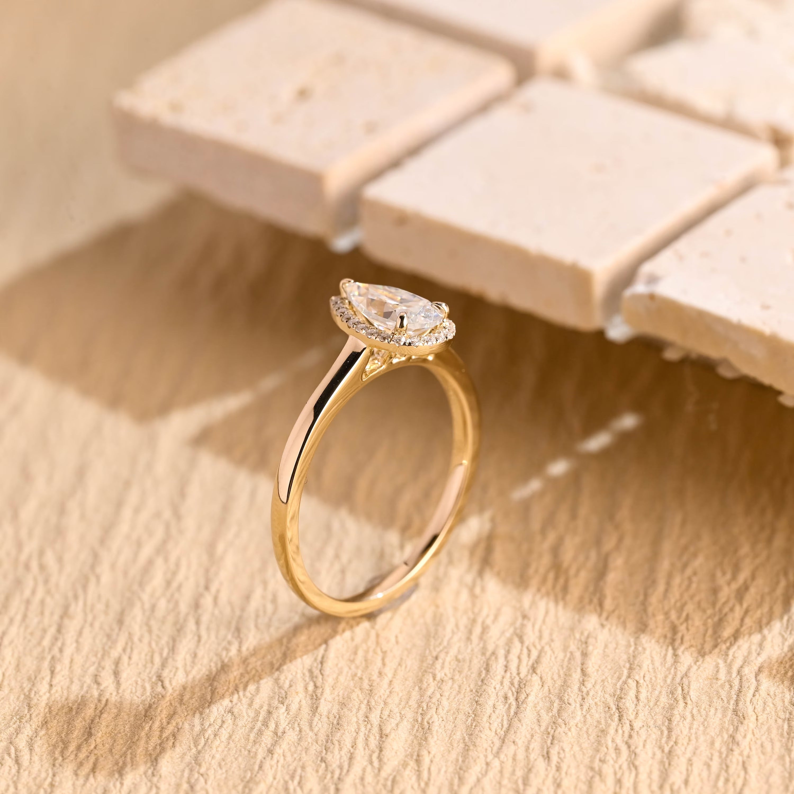 lab grown pear halo engagement ring