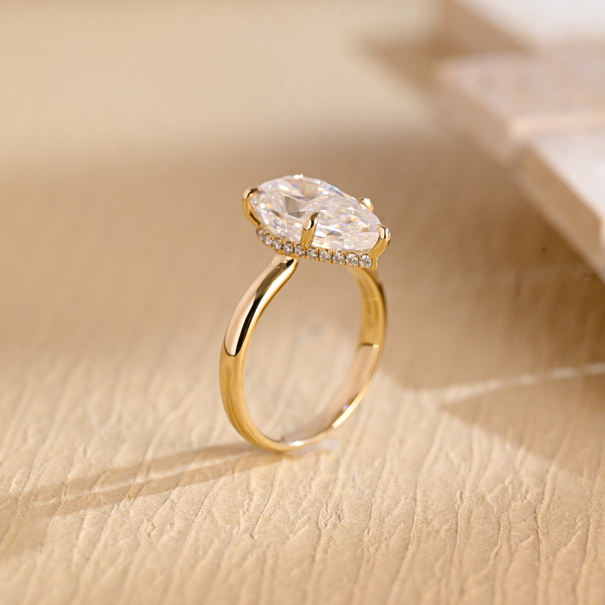 sustainable pear hidden halo engagement ring moissanite