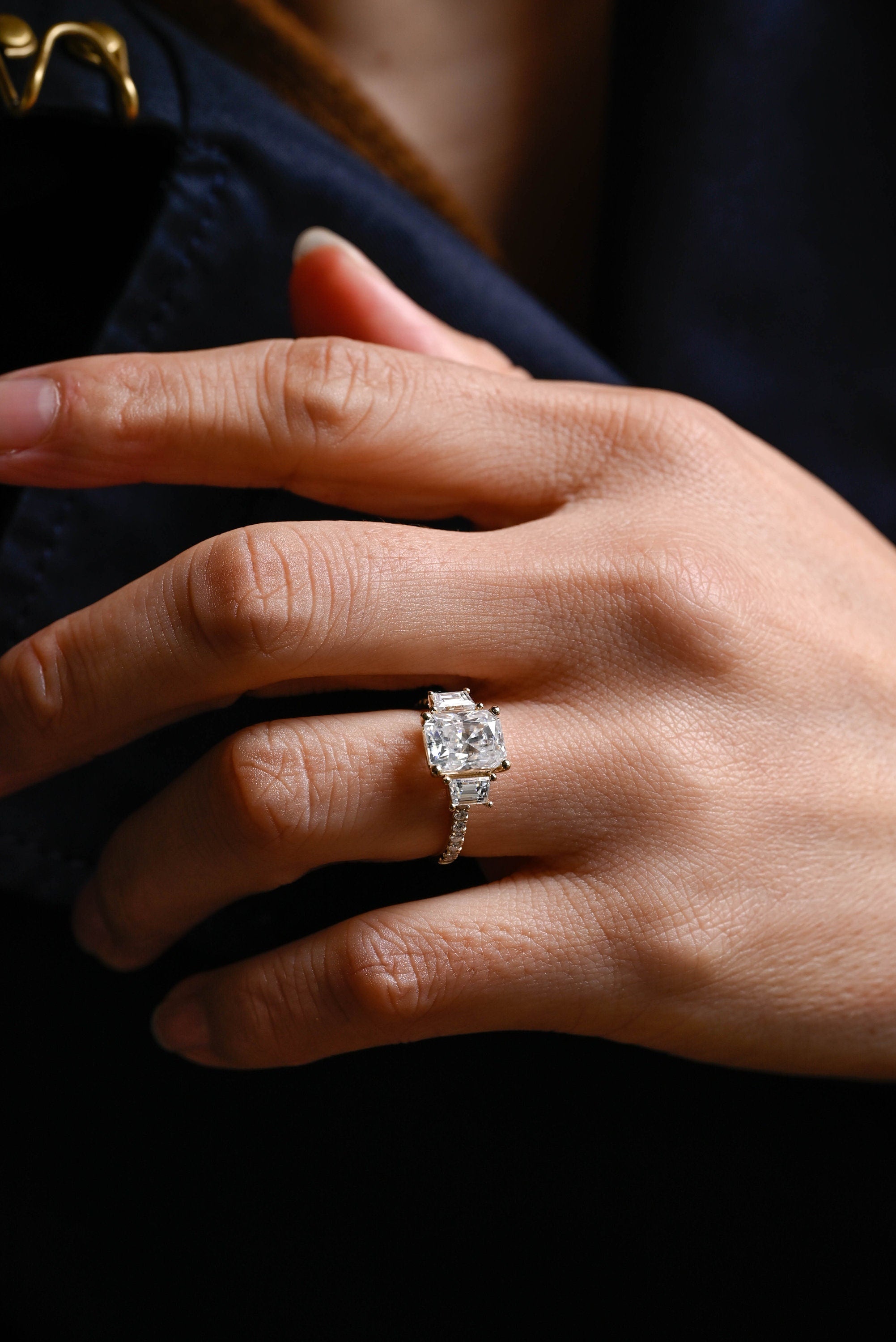 elegant three stone moissanite engagement ring radiant cut