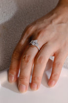 gold pavé three stone pear moissanite engagement ring