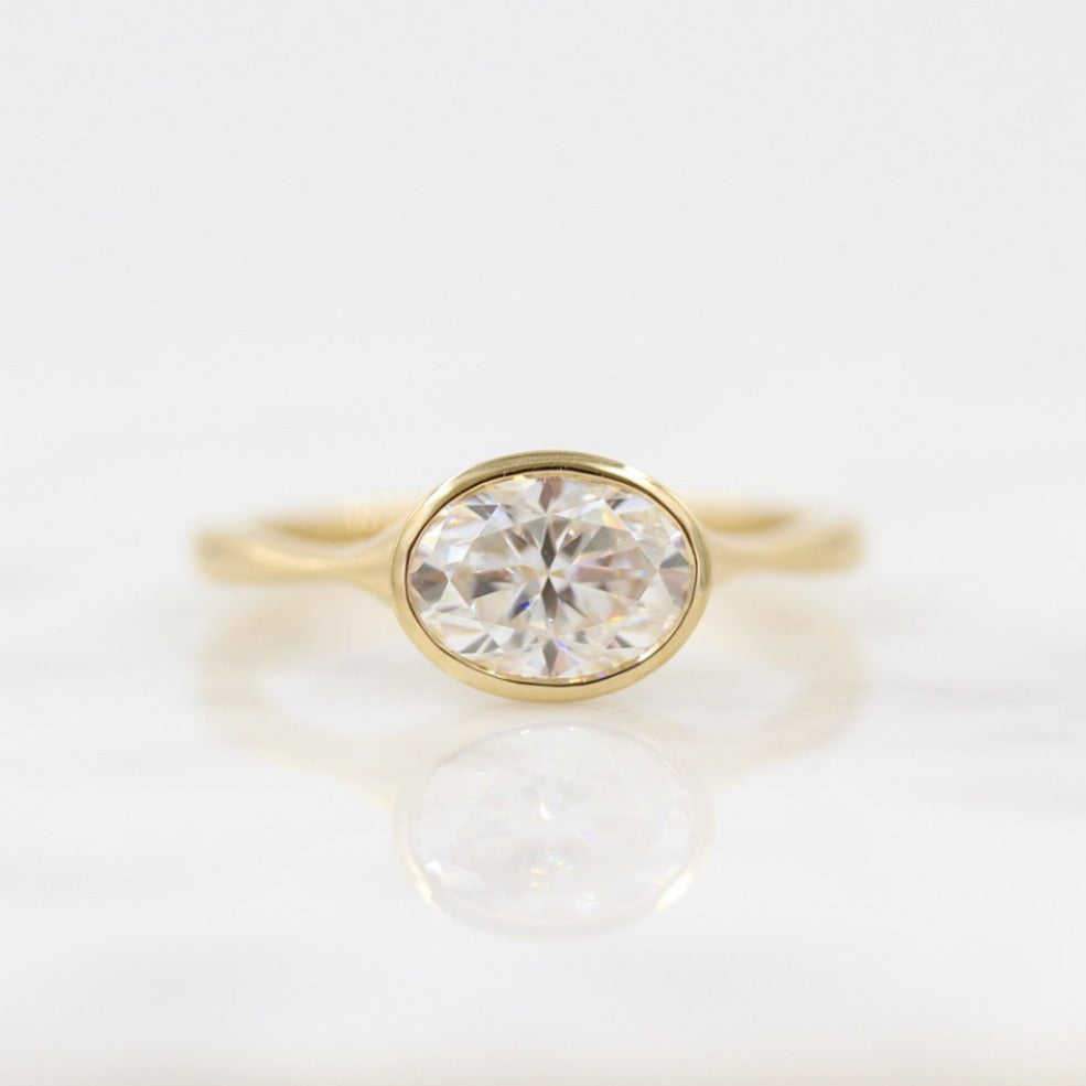 1.0ct East West Oval Moissanite Diamond Bezel Set Engagement Ring