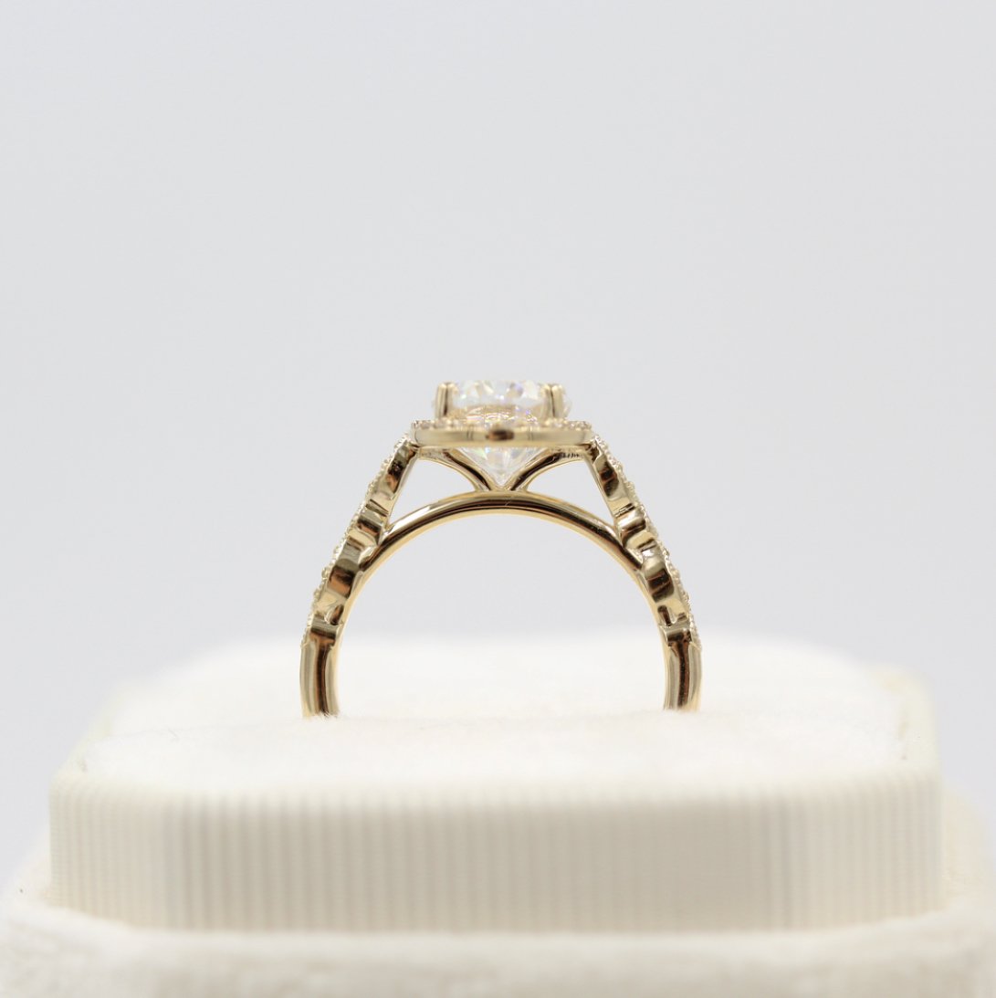 Vintage-inspired solitaire moissanite engagement rings with diamond accents