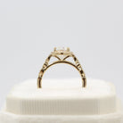 Vintage-inspired solitaire moissanite engagement rings with diamond accents