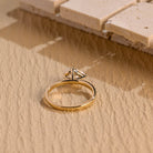 east west style moissanite engagement ring pear shape