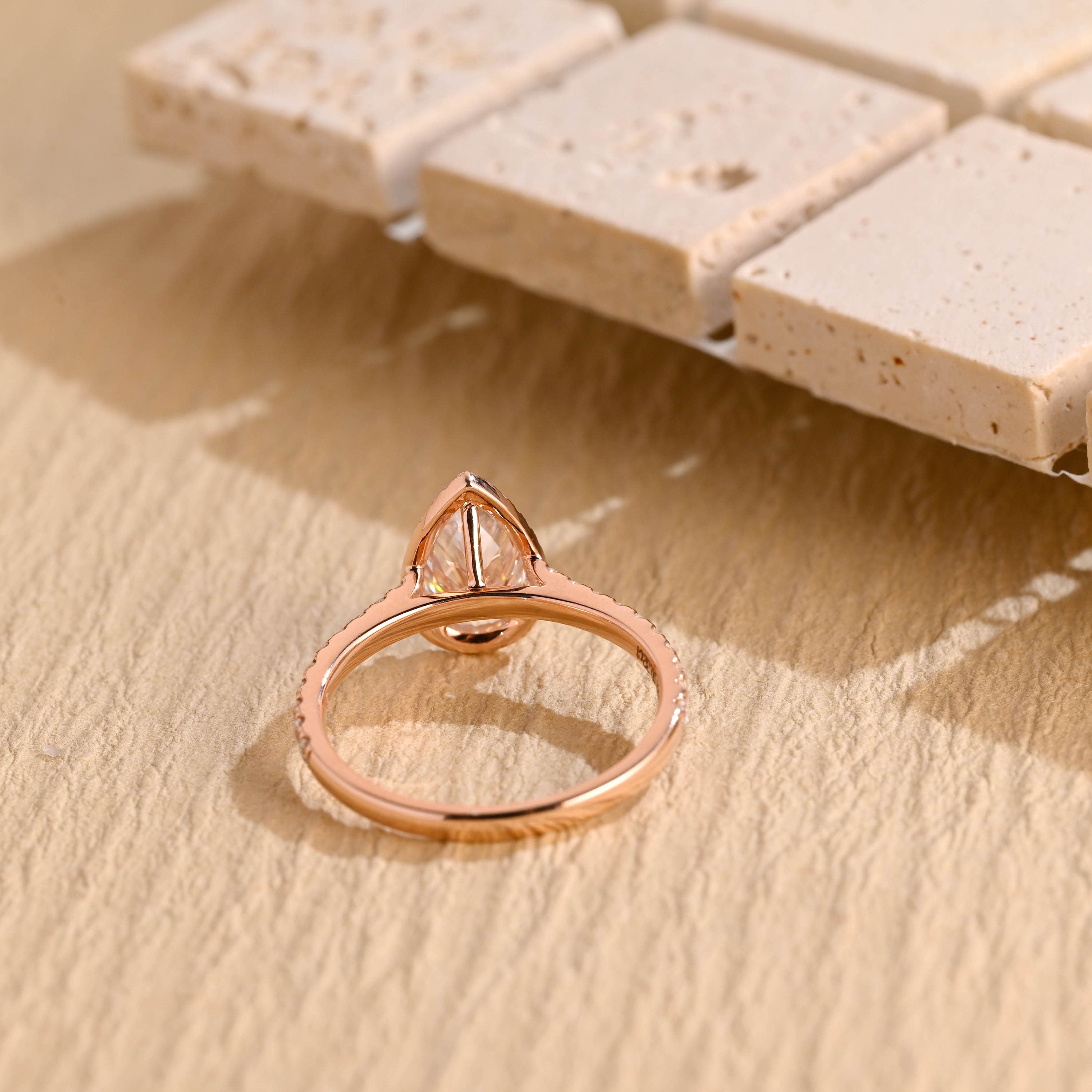 designer pear halo pavé moissanite ring