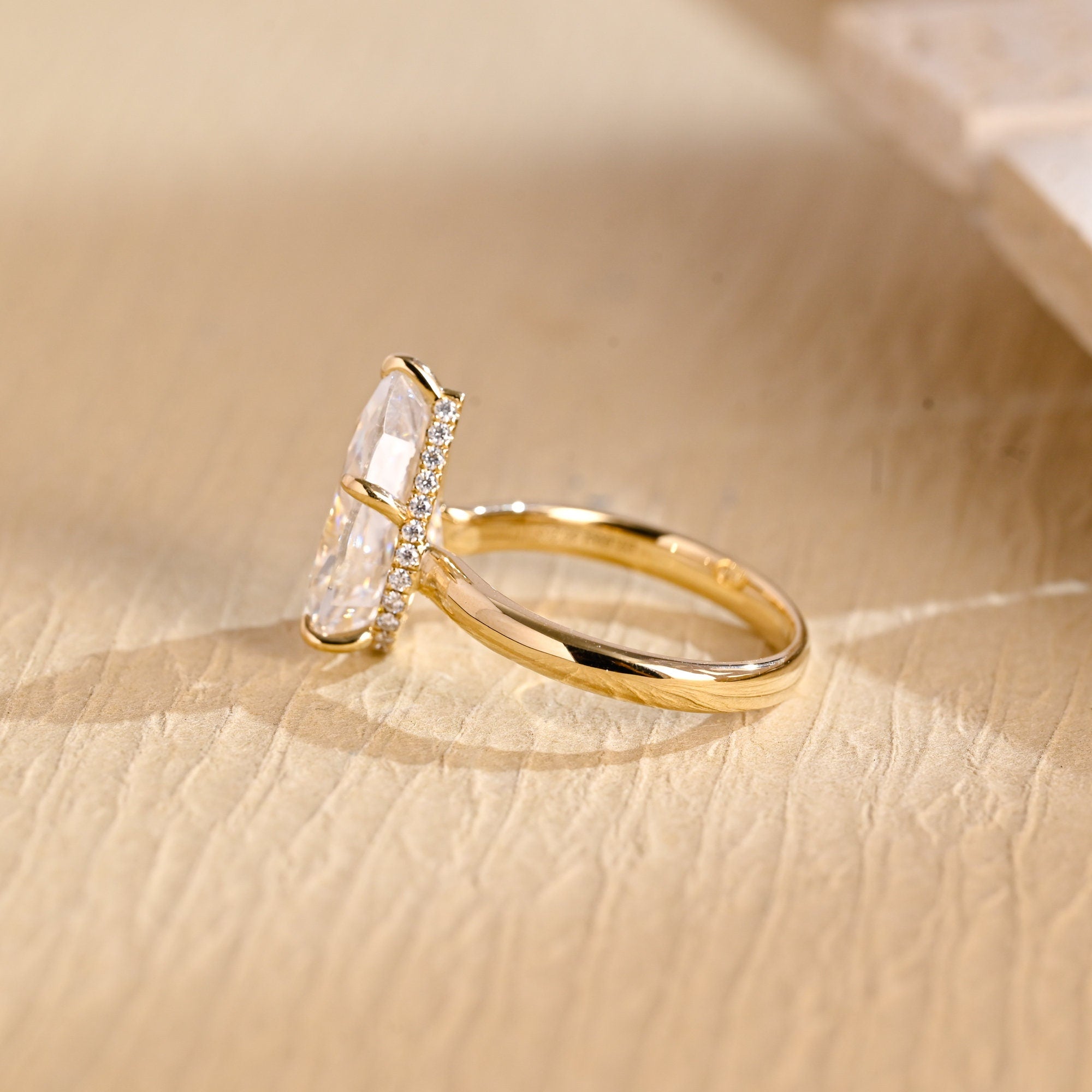 sustainable pear hidden halo engagement ring moissanite
