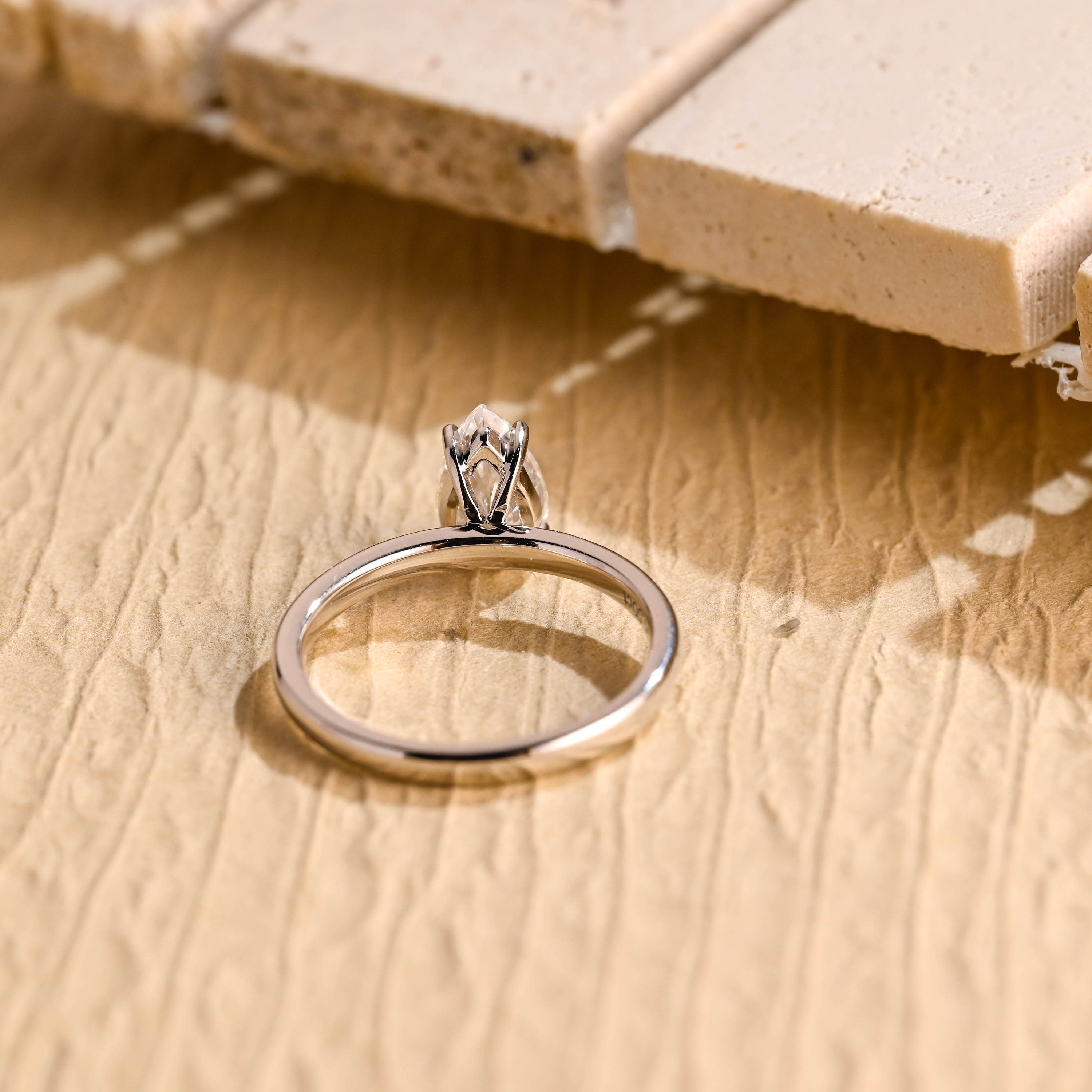 diamond alternative pear solitaire engagement ring