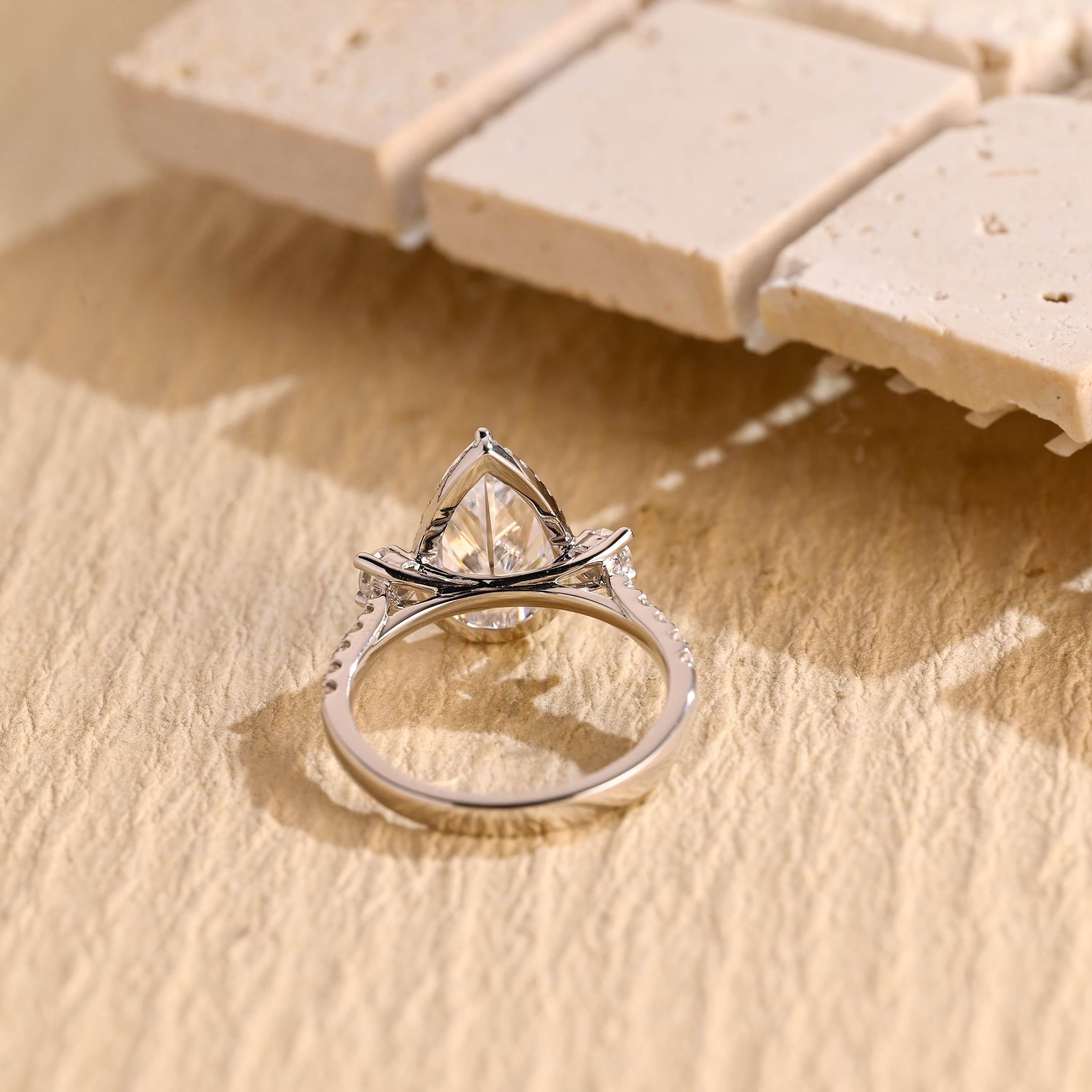 diamond alternative pear three stone engagement ring