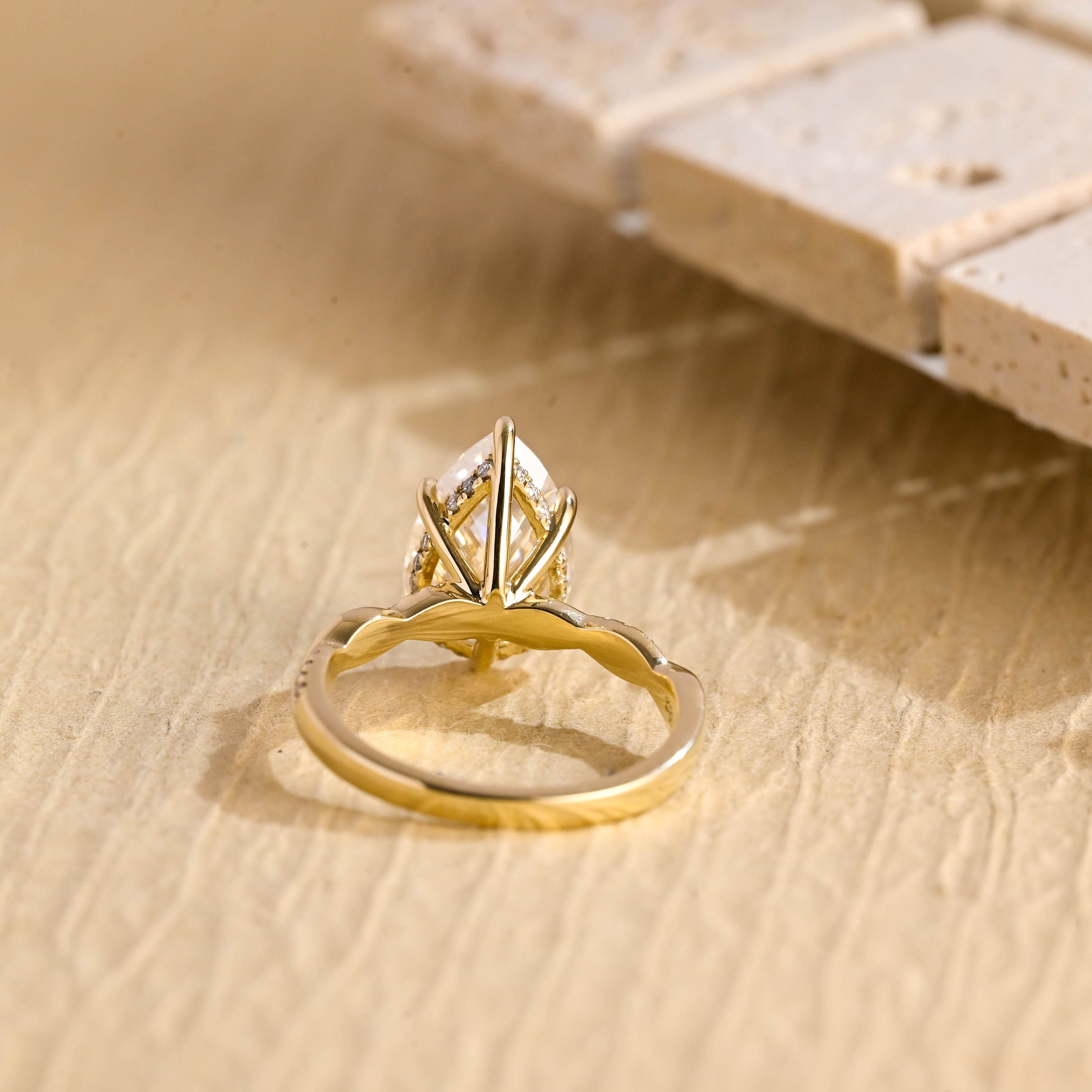 twisted band pear engagement ring moissanite