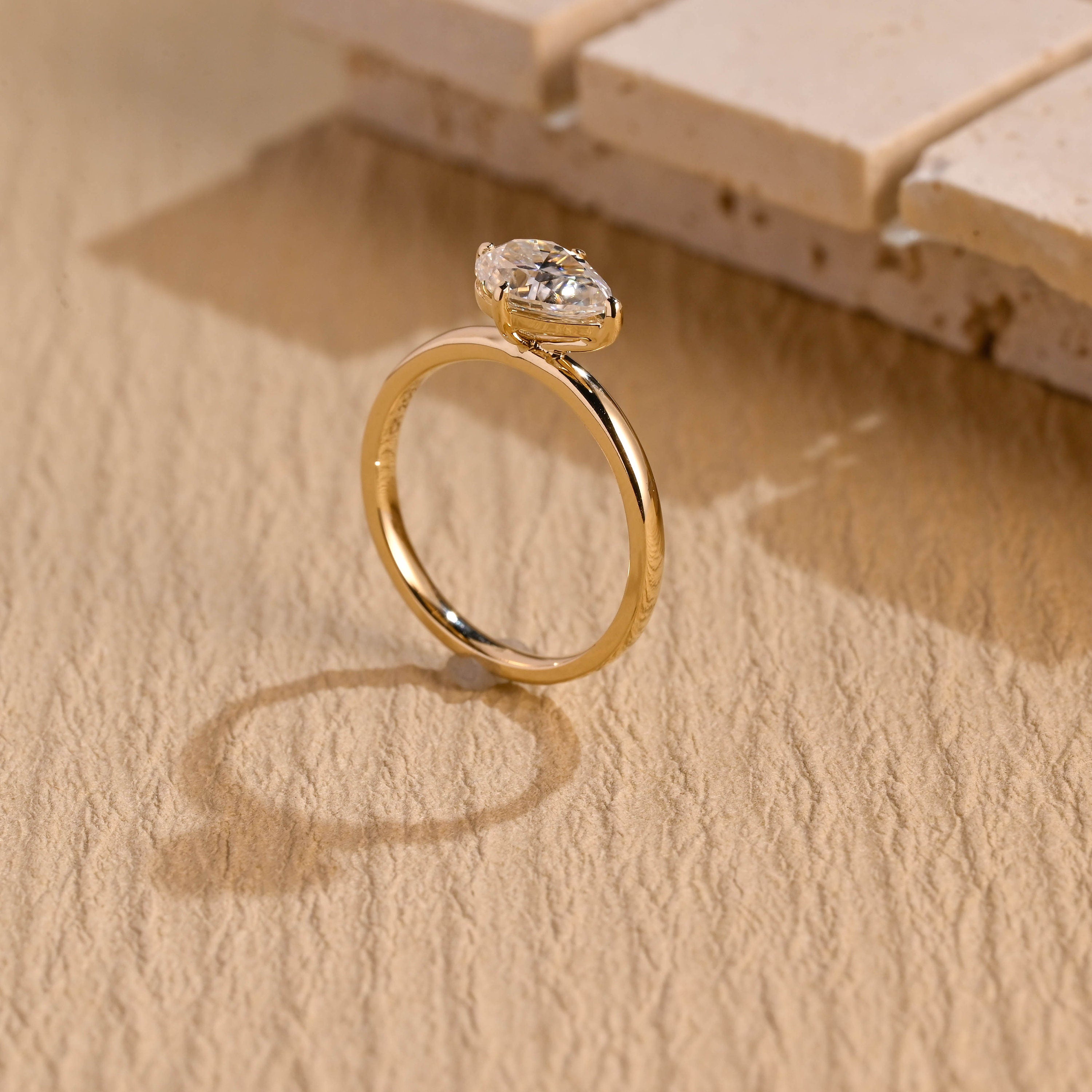 sustainable east west pear engagement ring moissanite