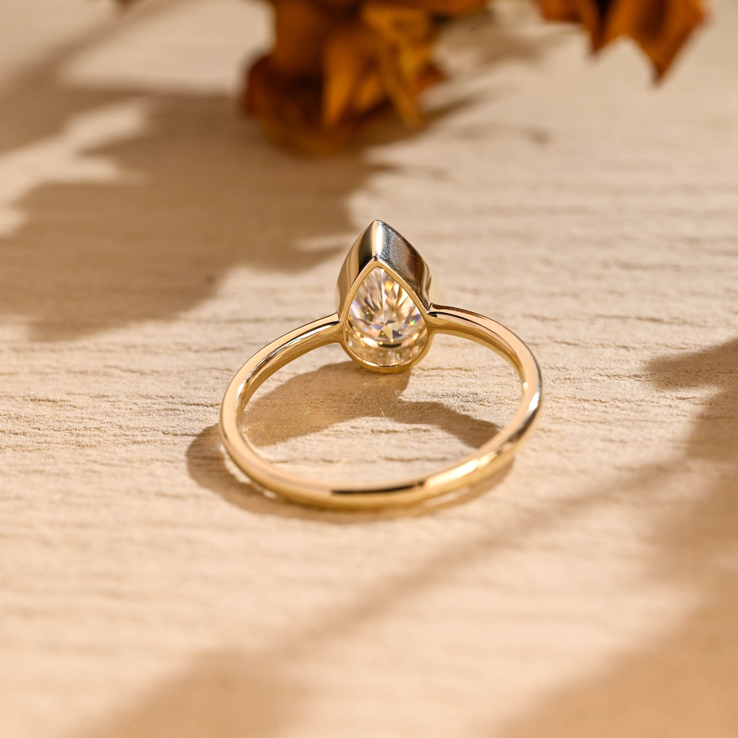 diamond alternative pear bezel engagement ring