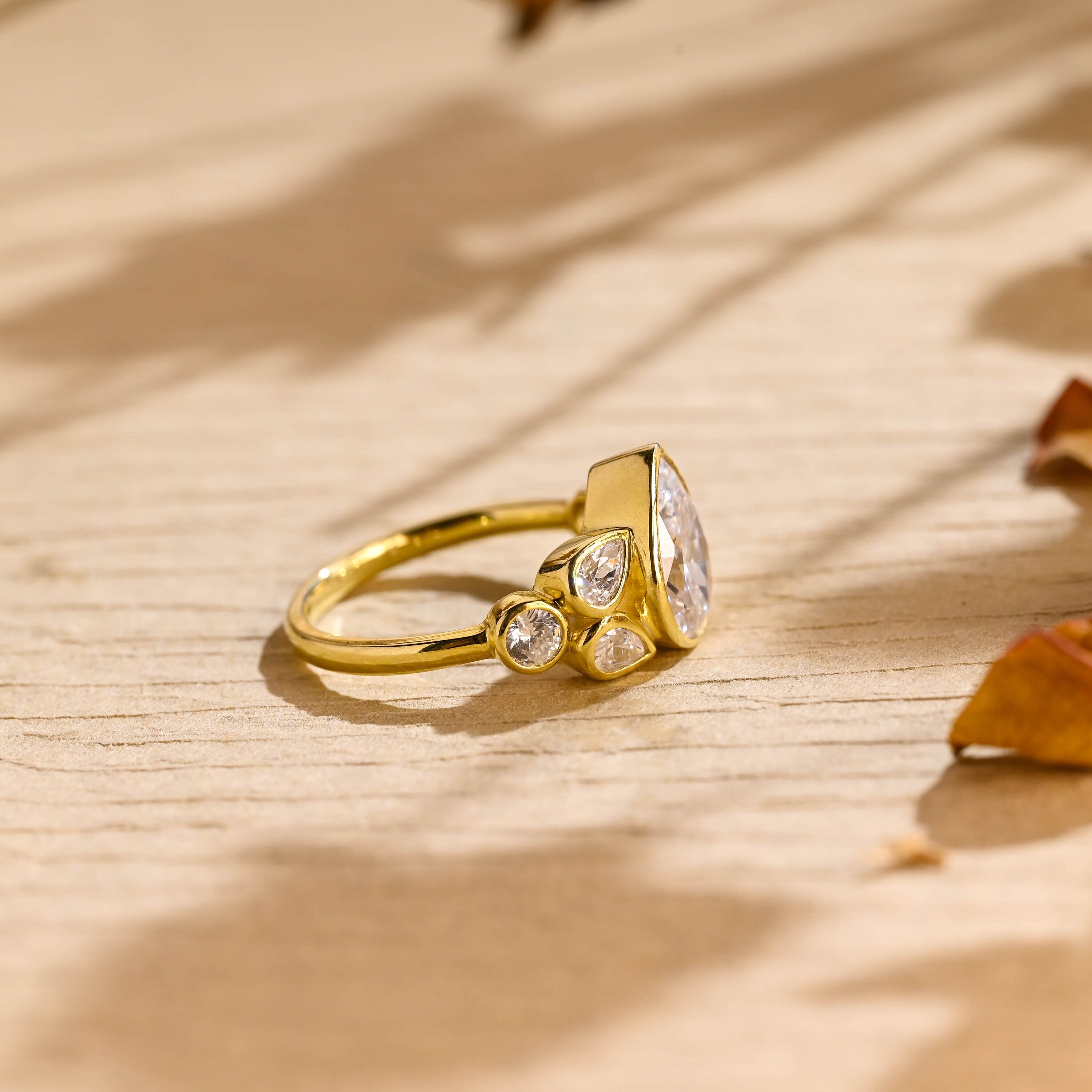 ethical pear cut seven stone moissanite engagement ring