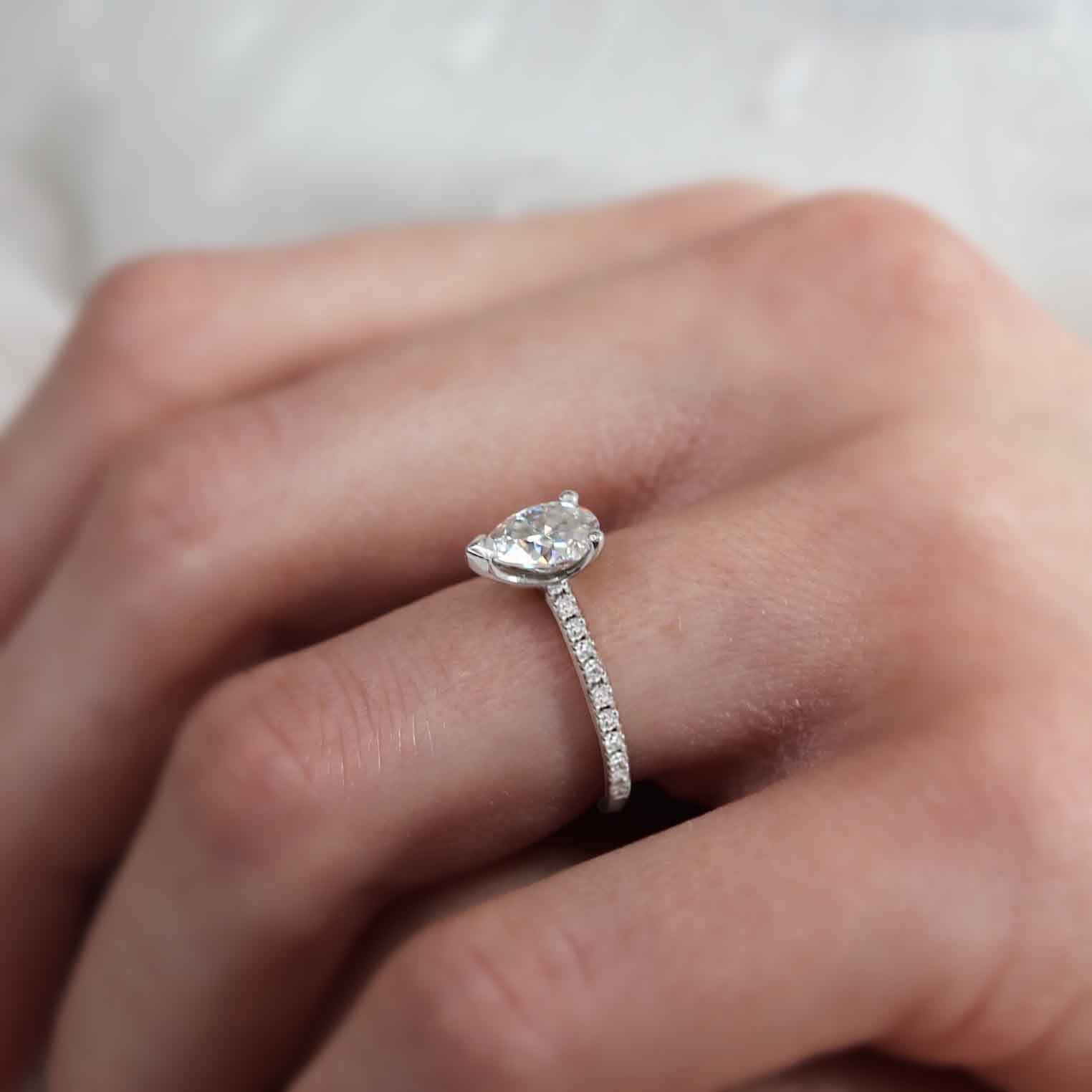 pear-shaped-moissanite-solitaire-pave-style-engagement-ring