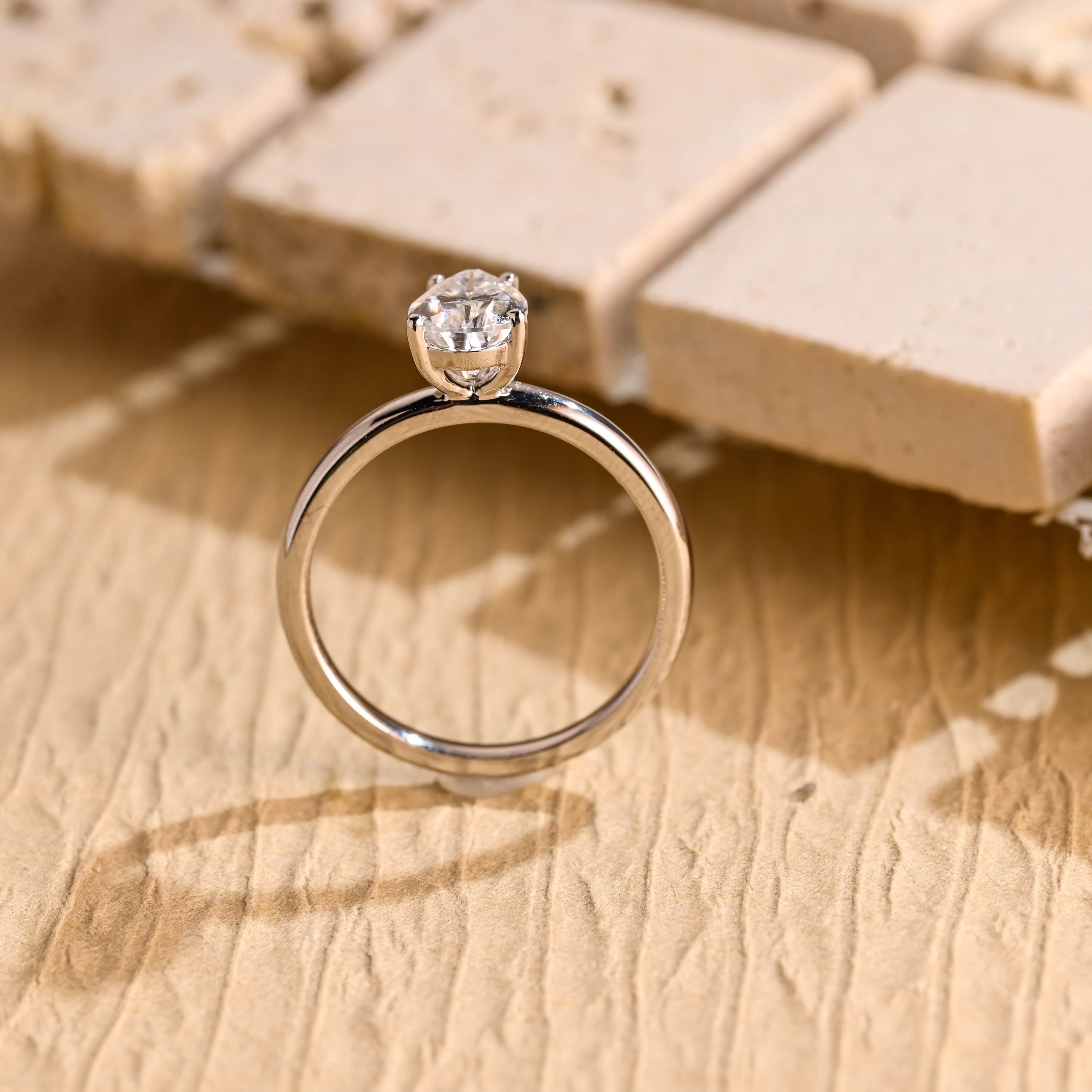 sparkling pear cut solitaire moissanite ring
