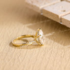 twisted band pear engagement ring moissanite