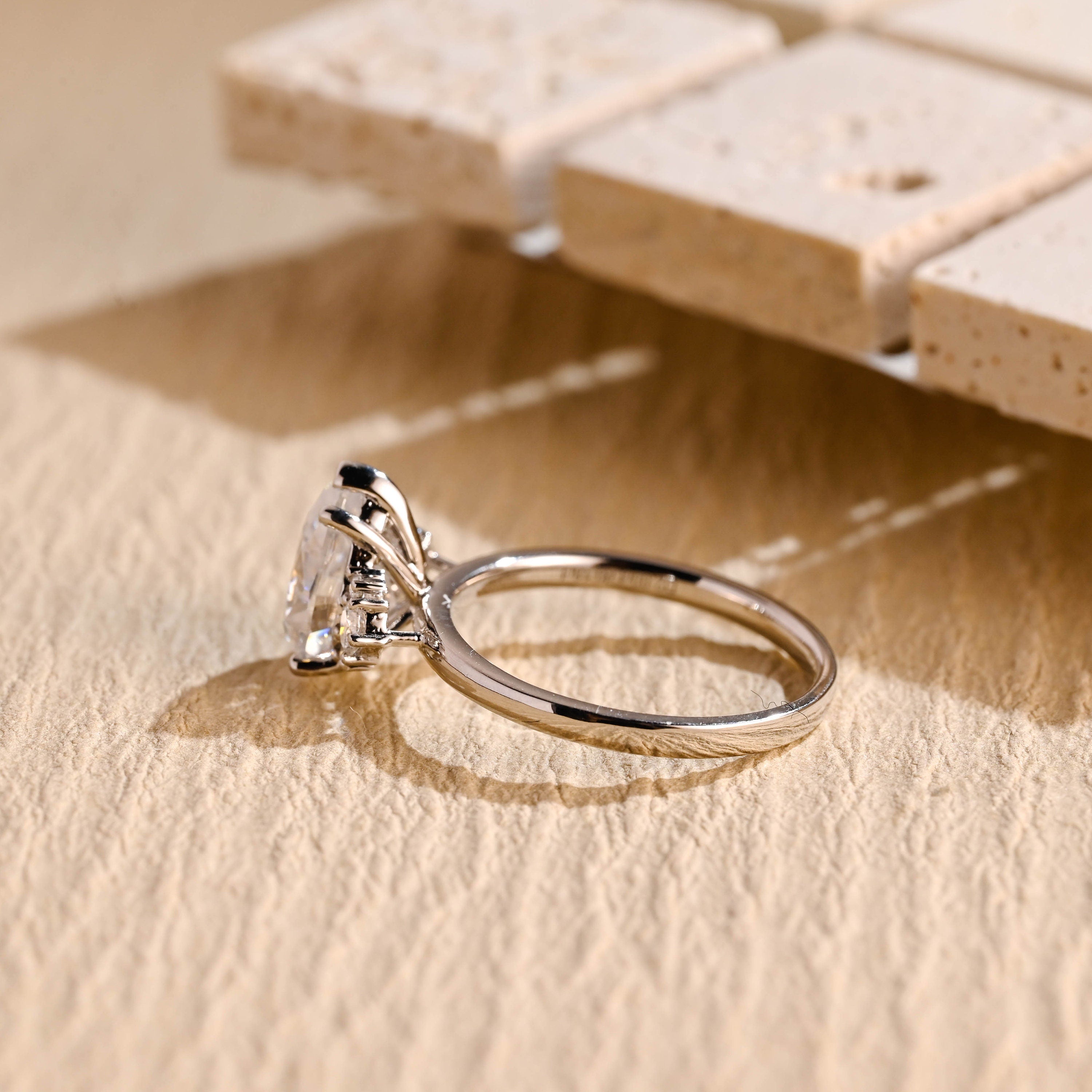 pear cut cluster engagement ring moissanite