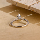 sustainable pear engagement ring moissanite