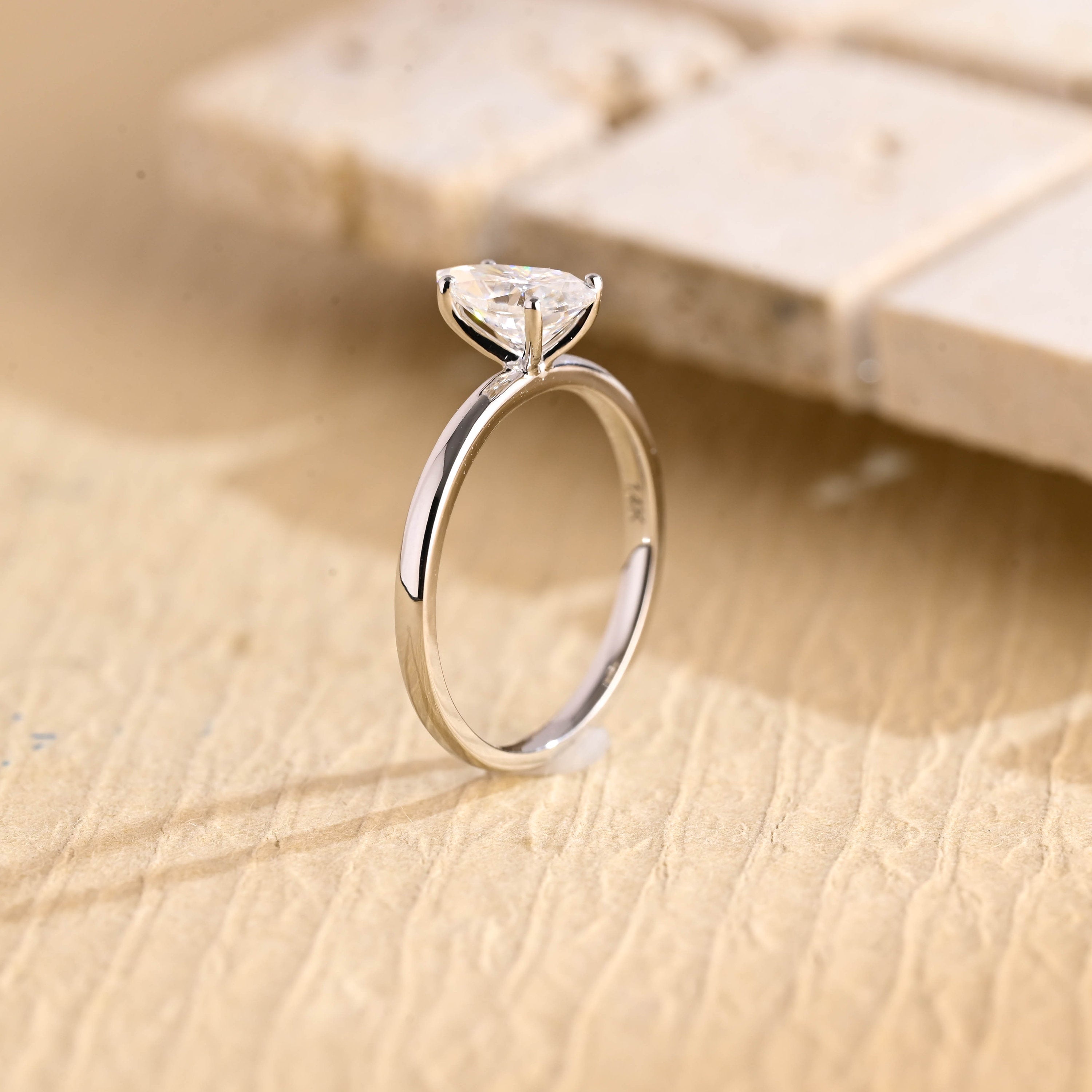 sparkling pear cut solitaire engagement ring moissanite