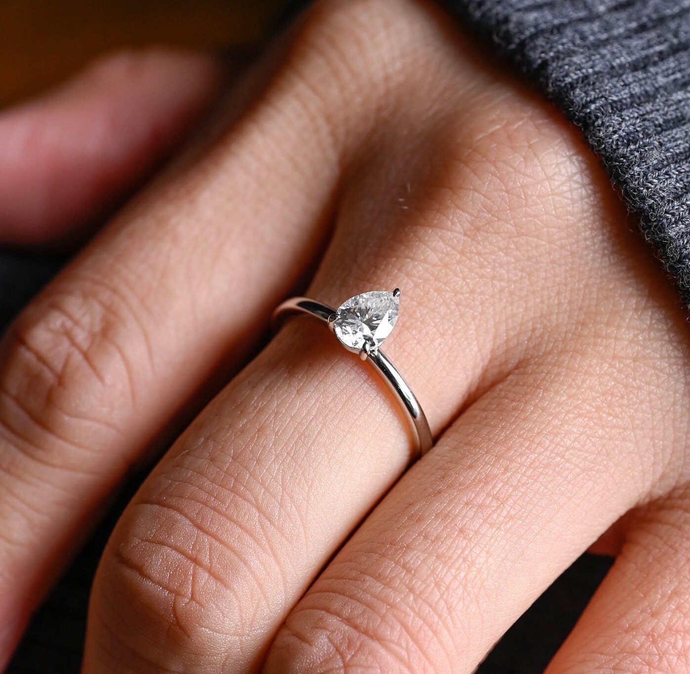 minimal pear cut solitaire engagement ring
